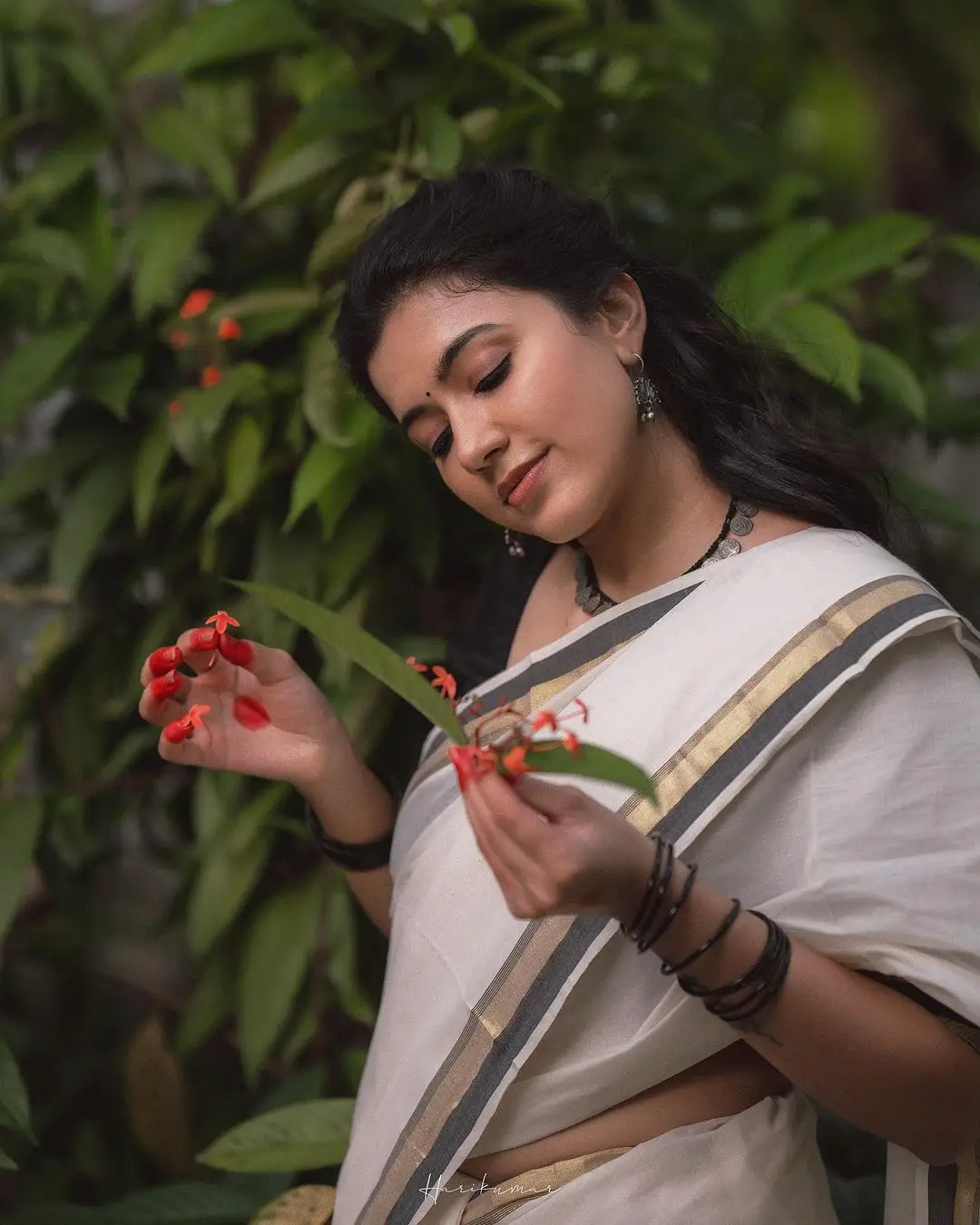 Malayalam Actress Anju Kurian Stills in White Saree Black Blouse